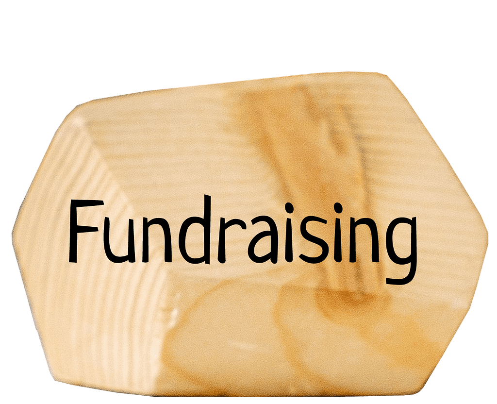 Wooden block with text 'Fundraising'